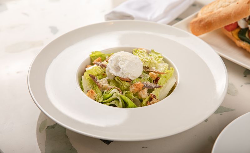 Caesar Italiano salad with anchovies and Parmigiano